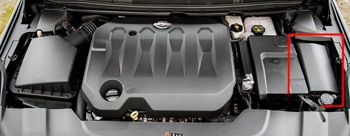 the location of the fuses in the engine compartment: cadillac xts (2013-2018)